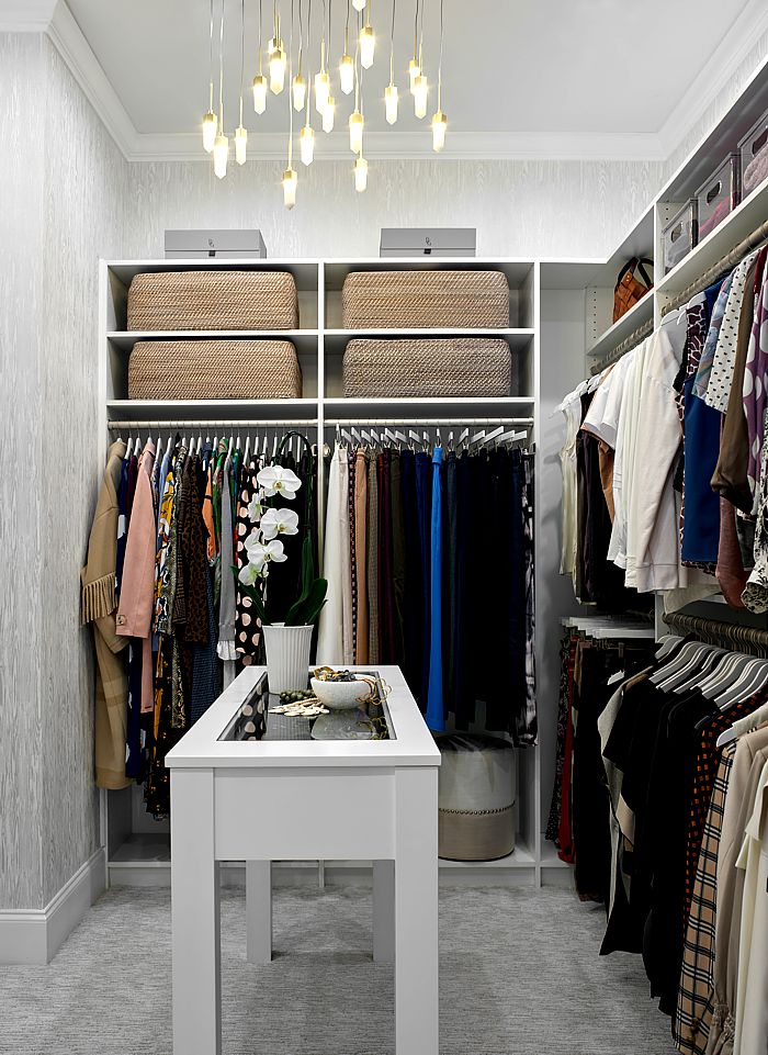If you have the space in your custom closet an island is a versatile item.